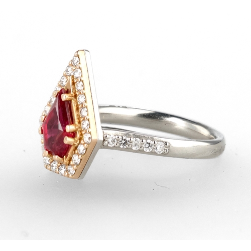 4 - A MODERN 18 CARAT WHITE GOLD AND PLATINUM RUBY AND DIAMOND RING
The fancy cut ruby, weight 1.35cts, ... 