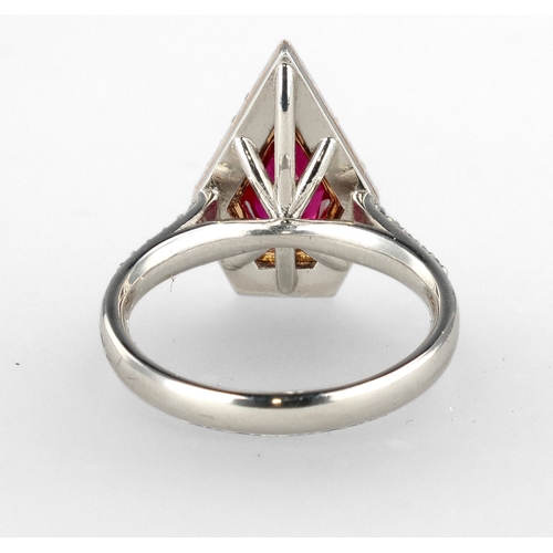 4 - A MODERN 18 CARAT WHITE GOLD AND PLATINUM RUBY AND DIAMOND RING
The fancy cut ruby, weight 1.35cts, ... 