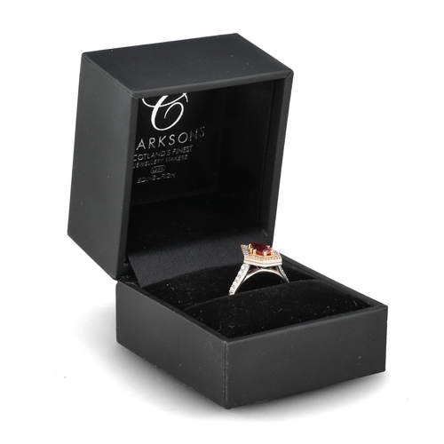 4 - A MODERN 18 CARAT WHITE GOLD AND PLATINUM RUBY AND DIAMOND RING
The fancy cut ruby, weight 1.35cts, ... 