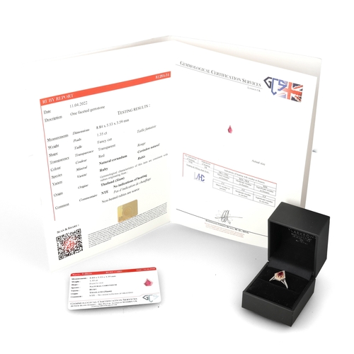 4 - A MODERN 18 CARAT WHITE GOLD AND PLATINUM RUBY AND DIAMOND RING
The fancy cut ruby, weight 1.35cts, ... 