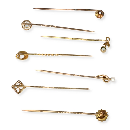 46 - A GROUP OF SEVEN 9CT GOLD STICK PINS, SET WITH VARIOUS STONES INCLUDING DIAMOND, PEARLS
Total weight... 