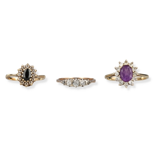 51 - A GOLD SAPPHIRE CLUSTER RING TOGETHER WITH A 9CT GOLD AMETHYST CLUSTER RING AND ANOTHER 9CT GOLD FIV... 