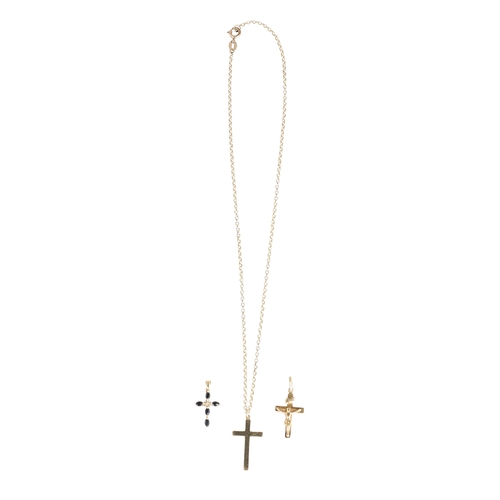 52 - THREE 9CT GOLD CROSSES, ONE WITH 9CT GOLD CHAIN
Total weight: 5.1gms