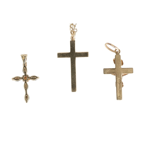 52 - THREE 9CT GOLD CROSSES, ONE WITH 9CT GOLD CHAIN
Total weight: 5.1gms