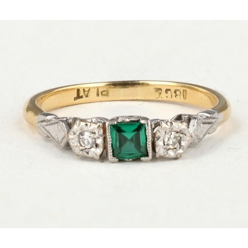61 - AN 18CT GOLD AND PLATINUM THREE STONE RING, CENTRAL SQUARE CUT EMERALD WITH TWO DIAMONDS
Band marked... 