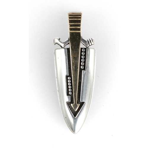 63 - AN ART DECO MODERNIST STYLE GOLD AND SILVER PENDANT, 14CT AND 925
21 gms
With associated tooled box.... 