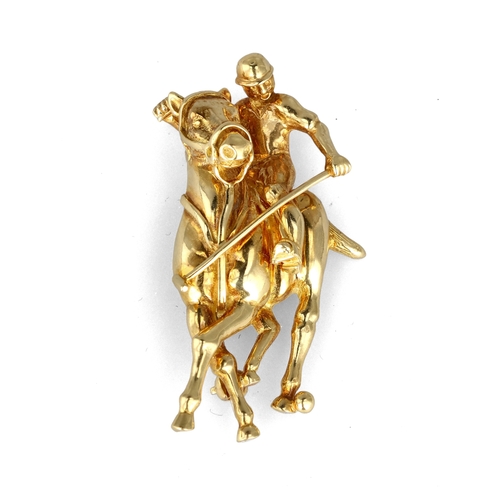 7 - THEO FENNELL (BRITISH B.1951): AN 18CT GOLD BROOCH IN THE FORM OF A POLO PLAYER ON HORSEBACK
Signed ... 