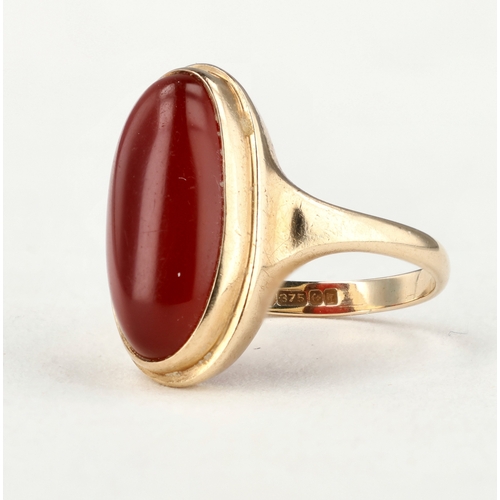 72 - A 9CT GOLD RING SET WITH RED OVAL CABOCHON STONE
Weight: 4.3gms