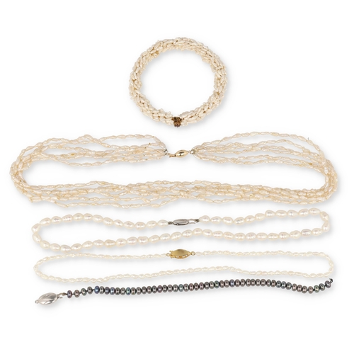 75 - A SIX STRAND FRESHWATER PEARL NECKLACE WITH 14 CARAT GOLD CLASP
Two ropes of freshwater pearls, one ... 