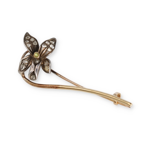 76 - A GOLD AND SILVER PIN BROOCH WITH DIAMOND SET FLORAL HEAD
Weight: 4.0gms