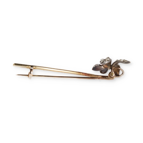 76 - A GOLD AND SILVER PIN BROOCH WITH DIAMOND SET FLORAL HEAD
Weight: 4.0gms