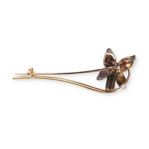 76 - A GOLD AND SILVER PIN BROOCH WITH DIAMOND SET FLORAL HEAD
Weight: 4.0gms