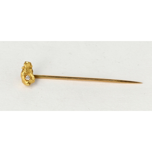 77 - A 9CT GOLD STICK PIN WITH RAW GOLD NUGGET SET WITH A DIAMOND
Weight: 2.6gms