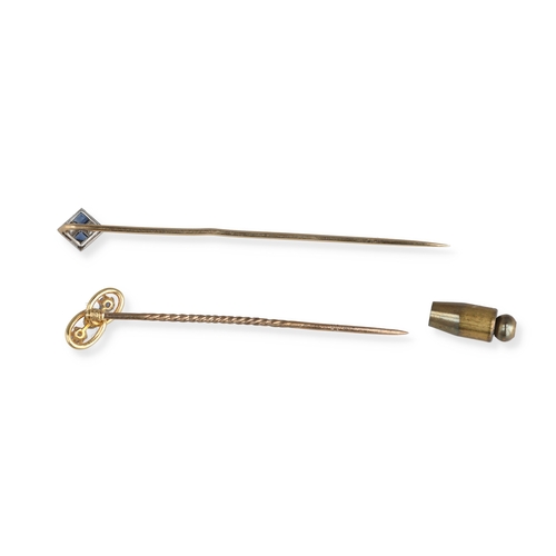 79 - A MATCHED PAIR OF 9CT GOLD STICK PINS SET WITH SAPPHIRES AND DIAMONDS
Total weight: 2.3gms
In blue R... 