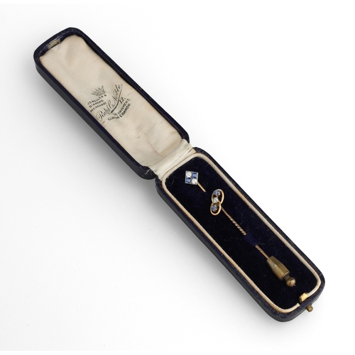 79 - A MATCHED PAIR OF 9CT GOLD STICK PINS SET WITH SAPPHIRES AND DIAMONDS
Total weight: 2.3gms
In blue R... 