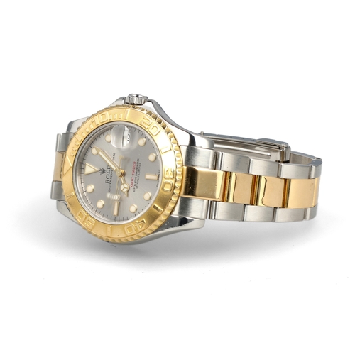 93 - ROLEX: A GENTLEMAN'S18CT GOLD AND STEEL YACHT-MASTER WATCH
With Rolex papers.
 