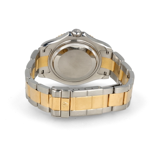 93 - ROLEX: A GENTLEMAN'S18CT GOLD AND STEEL YACHT-MASTER WATCH
With Rolex papers.
 