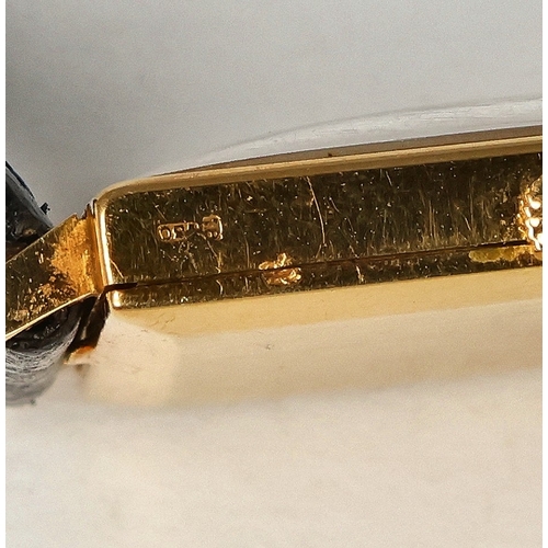 95 - ROLEX: AN 18CT GENEVE WATCH WITH LEATHER STRAP