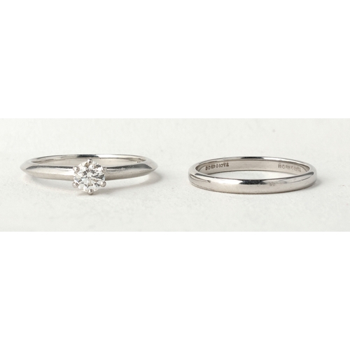 96 - TIFFANY & CO: A PLATINUM SOLITAIRE DIAMOND RING TOGETHER WITH A MATCHING PLATINUM WEDDING BAND
W... 