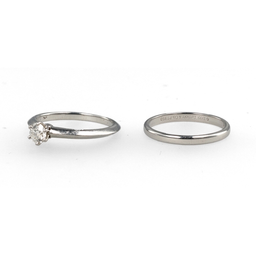 96 - TIFFANY & CO: A PLATINUM SOLITAIRE DIAMOND RING TOGETHER WITH A MATCHING PLATINUM WEDDING BAND
W... 