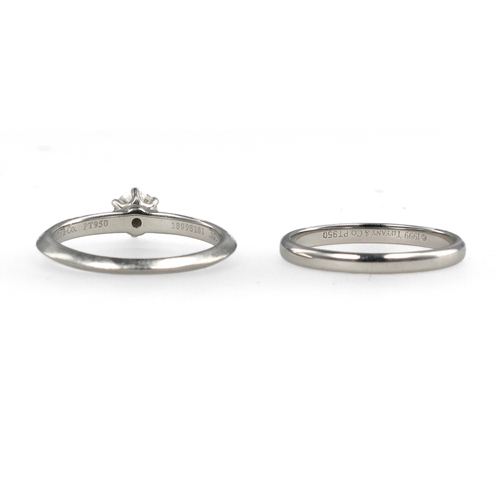 96 - TIFFANY & CO: A PLATINUM SOLITAIRE DIAMOND RING TOGETHER WITH A MATCHING PLATINUM WEDDING BAND
W... 