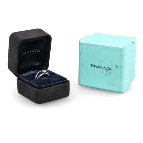 96 - TIFFANY & CO: A PLATINUM SOLITAIRE DIAMOND RING TOGETHER WITH A MATCHING PLATINUM WEDDING BAND
W... 