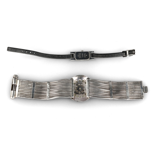 110 - A SILVER TWELVE-STRAND STONE SET BRACELET, PROBABLY INDIAN
With articulated linking, interspaced by ... 