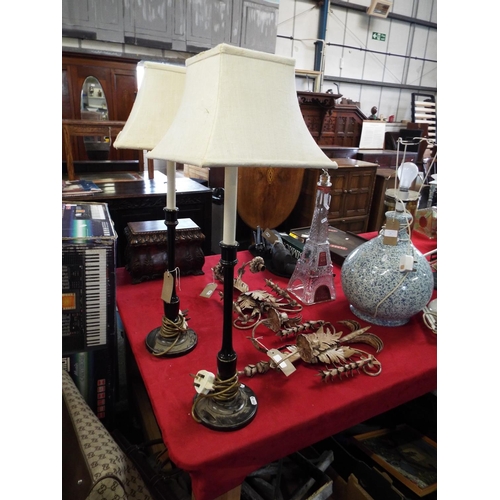 250 - A pair of black lacquered candlestick table lamps