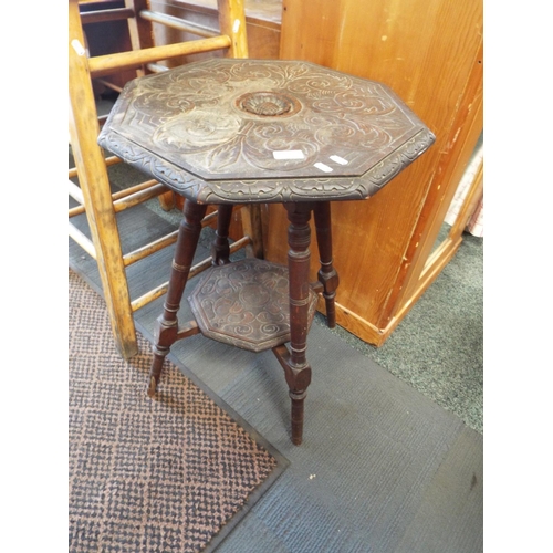 591 - A late Victorian stained mahogany gypsy style side table, the octagonal top and under tier heavily c... 