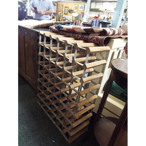 595 - A vintage pine and galvanised forty-eight section free standing wine rack