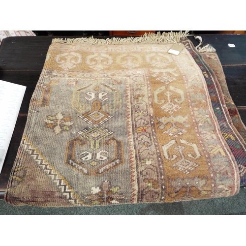 599 - An Oriental Kayam geometrically woven blue ground rug 178 cm x 109 cm