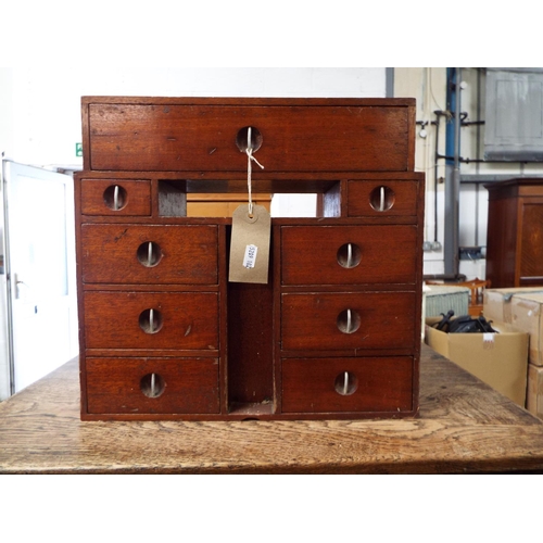 602 - A scratch built mahogany Art Deco miniature chest fitted with one long over eight short drawers