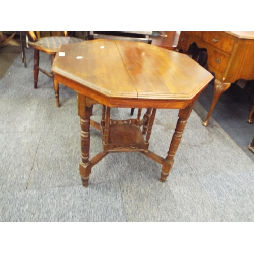 505 - An Edwardian mahogany octagonal table with under tier