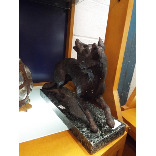 69 - A 1930's bronzed cast iron fox raised on a marble plinth