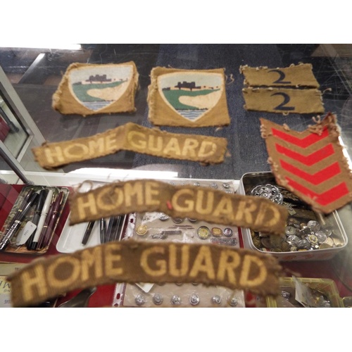 77 - A selection of Kent Home Guard Insignia an LDV arm band, WWII Boy Scouts woolen shirt, badge and boo... 