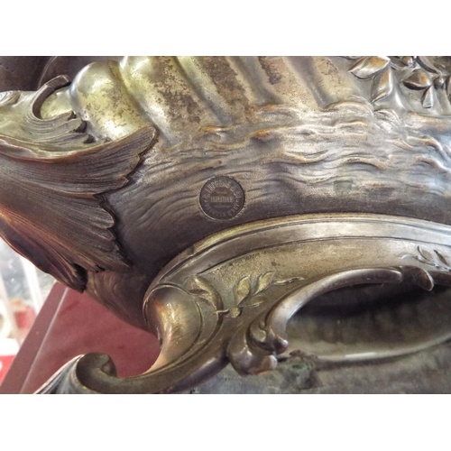 17 - A 19thC H. Luppens & Co of Brussels bronze de-art ornate table centre piece, having a fluted body wi... 