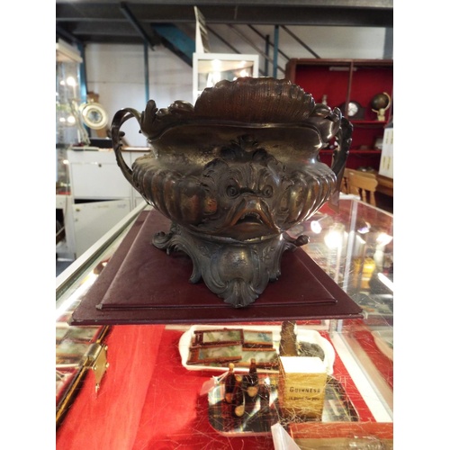 17 - A 19thC H. Luppens & Co of Brussels bronze de-art ornate table centre piece, having a fluted body wi... 