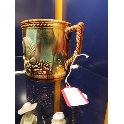 1 - A Victorian slip-ware mug having embossed shell decoration
