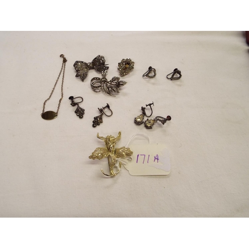 171A - A mixed selection of silver items to include a marcasite set bow brooch, orchid brooch, earrings, br... 