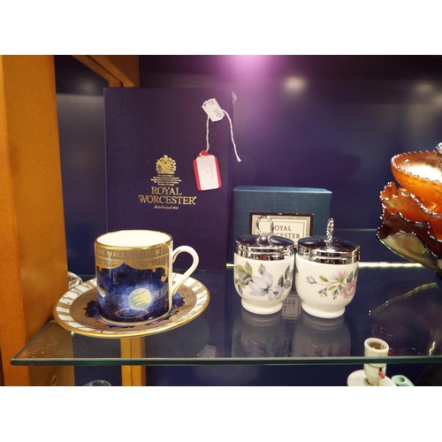 31 - A boxed Royal Worcester 'The Millennium' coffee can and saucer and a pair of boxed Royal Worcester e... 