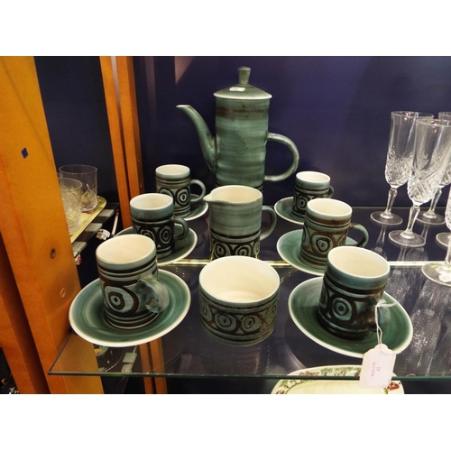 42 - A green and brown glazed Cinque Ports pottery coffee set to include six coffee cans, saucers, milk j... 