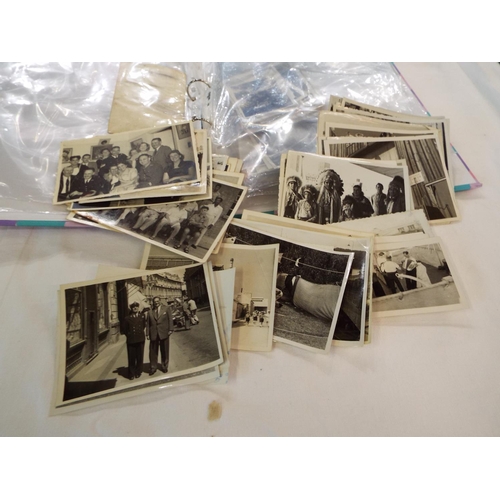 59 - A folder containing photographs of 1930s-1950s scenes to include military and Merchant Navy personne... 