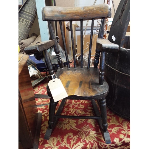 210 - A dolls stained wood rocking chair