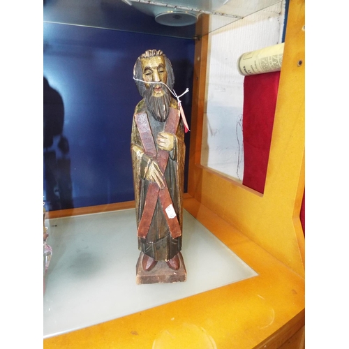 37 - A carved wooden figure of a priest