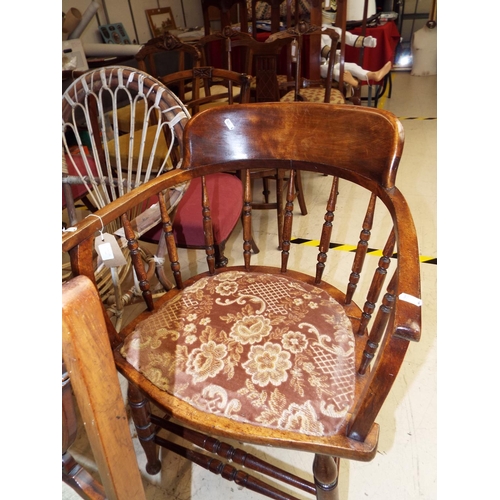 464 - A stained wood smokers bow spindle gallery chair
