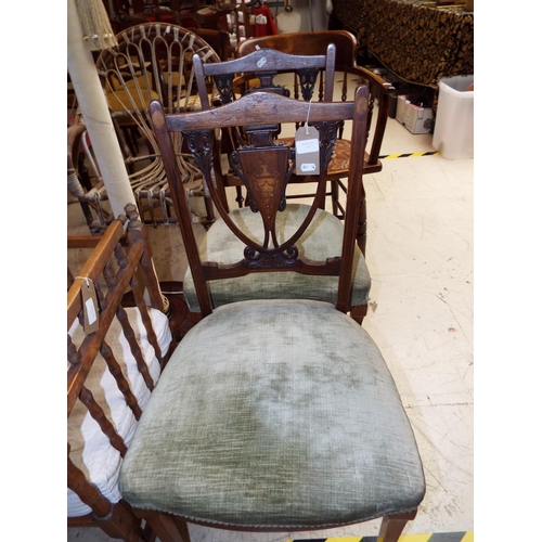 465 - A pair of Victorian Rosewood dining chairs having carved and inlaid shield shaped splats upholstered... 