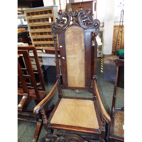 642 - A large 19thC ornate carved oak hall chair with bergere back rest and seat pad ornate carved stretch... 