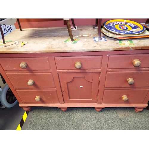 648 - A vintage painted pine dresser base having three short drawers above cupboards