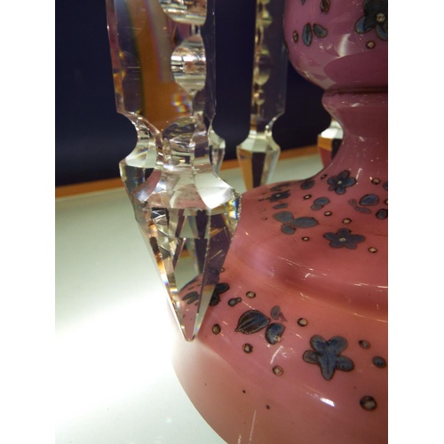 36A - A Victorian pink glass lustre with blue floral decoration and crystal droplets
