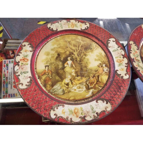 40 - A set of four rare 'Lipton's Advertising Tin' tea plates with pictorial scenes